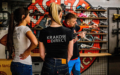 Instructor shows two women how to shoot at the Krakow shooting range.