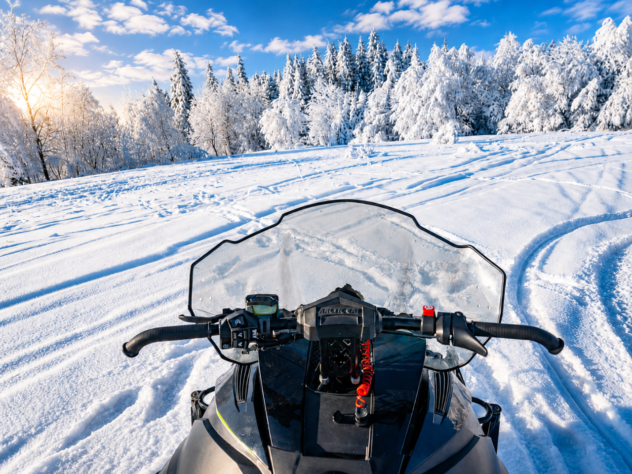 First-person view of a snowmobile trail First-person view from the snowmobile looking out over a snow-covered trail